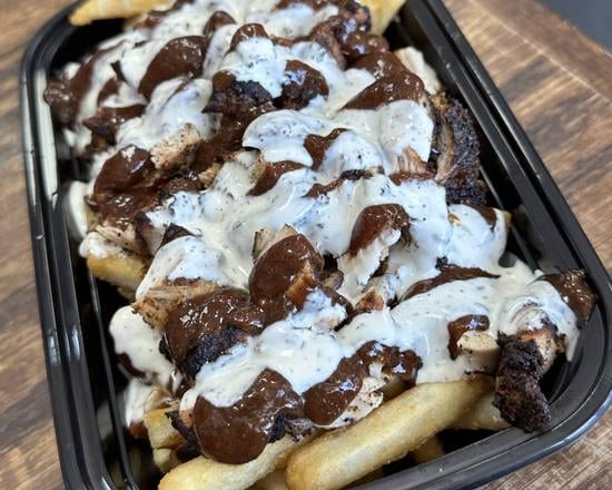 Jerk Chicken Over Fries.