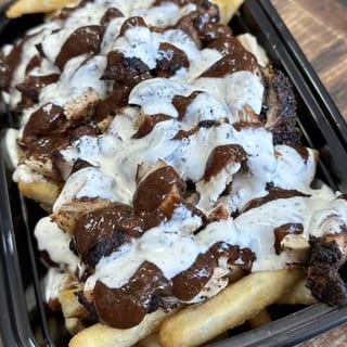 Jerk Chicken Over Fries